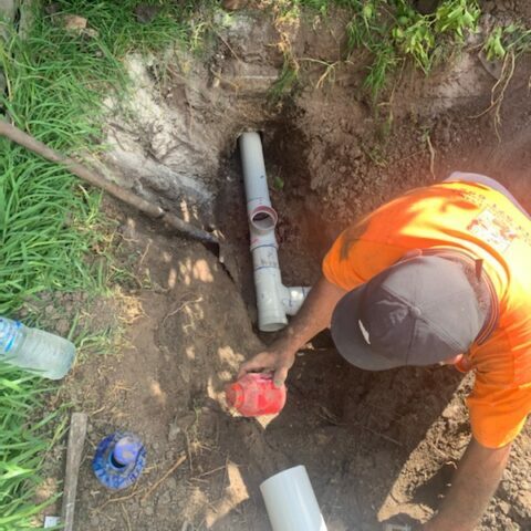 digging up and fixing a stormwater officer